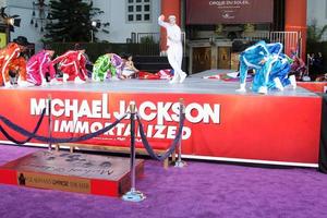 LOS ANGELES, JAN 26 - Cirque du Soleil Immortal Troupe perform at the Michael Jackson Immortalized Handprint and Footprint Ceremony at Graumans Chinese Theater on January 26, 2012 in Los Angeles, CA photo