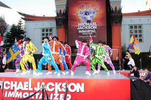 LOS ANGELES, JAN 26 - Cirque du Soleil Immortal Troupe perform at the Michael Jackson Immortalized Handprint and Footprint Ceremony at Graumans Chinese Theater on January 26, 2012 in Los Angeles, CA photo