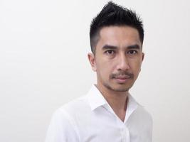 Portrait of smiling young man wearing white  shirt photo