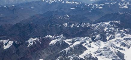 Himalaya mountains under clouds photo