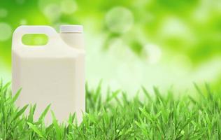 glass of milk Natural green blurred background photo
