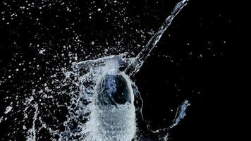 Abstract water jet crashes on a black background photo