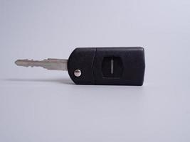 Car key with remote control isolated on gray background. photo