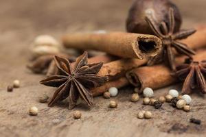 Spices lying on a wooden surface closeup photo