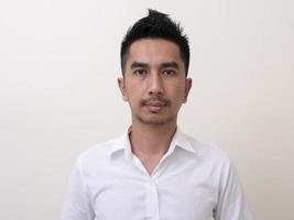 Portrait of smiling young man wearing white  shirt photo