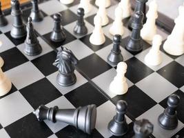 Chess board game with focus on black and white photo