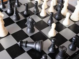 Chess board game with focus on black and white photo