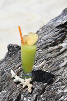 fruit cocktail on a tropical island beach photo