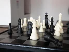 Chess board game with focus on black and white photo