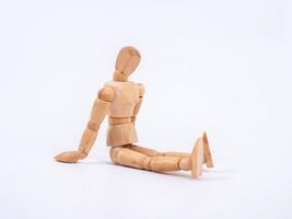 The wooden dummy sits on white background photo