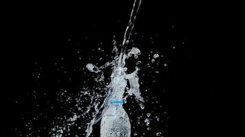 Abstract water jet crashes on a black background photo