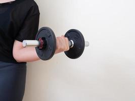 hand holding dumbbell isolated on white background photo