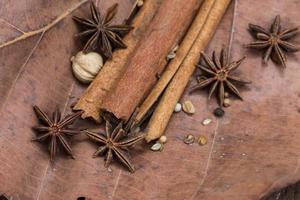 Spices lying on a wooden surface closeup photo