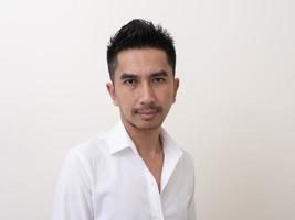 Portrait of smiling young man wearing white  shirt photo