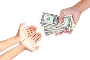 Hand handing over money to another hand isolated on white background photo