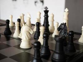 Chess board game with focus on black and white photo