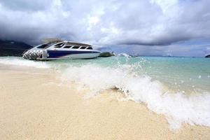 Speed boat anchored on beautiful photo