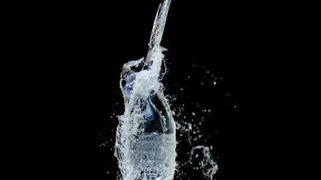 Abstract water jet crashes on a black background photo