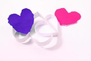 Paper hearts on white background photo