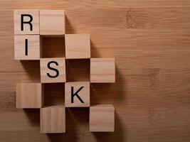 Word risk writing with wooden blocks photo