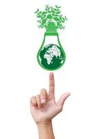 Hands holding green ecology light bulb photo
