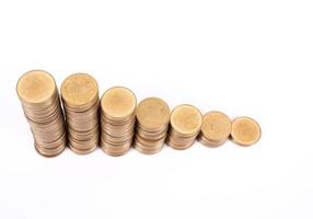 Savings, increasing columns of gold coins isolated on white background photo