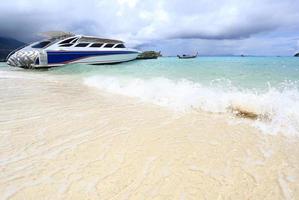 Speed boat anchored on beautiful photo