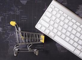 Online shopping with cart idea concept photo