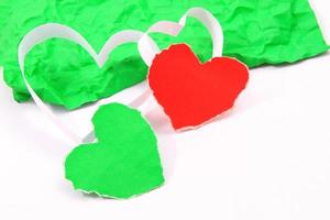 Paper hearts on white background photo