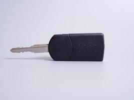 Car key with remote control isolated on gray background. photo