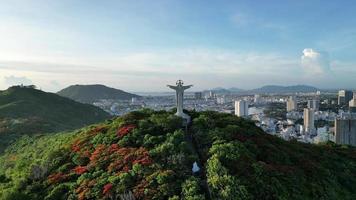 Top view of Vung Tau with statue of Jesus Christ on Mountain . the most popular local place. Christ the King, a statue of Jesus. Travel concept. video