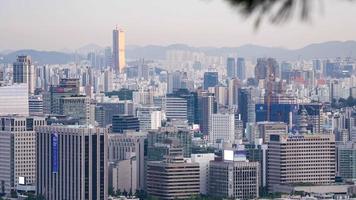 Time lapse shot of Seoul cityscape with 63 Building view from Samcheong Park, South Korea