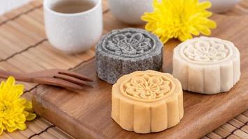 Colorful beautiful moon cake, mung bean cake, Champion Scholar Pastry cake for Mid-Autumn festival traditional gourmet dessert snack, close up. photo