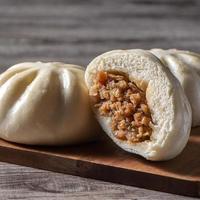 Close up of fresh delicious baozi, Chinese steamed meat bun. photo