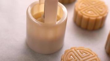 Homemade cantonese moon cake pastry on baking tray before baking for traditional festival, close up, lifestyle. photo