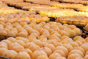 Making process of sun exposuring dried persimmon in a sieve in autumn. photo