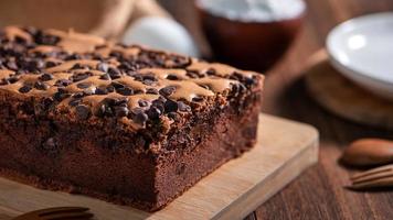 Chocolate flavor Taiwanese traditional sponge cake Taiwanese castella kasutera on a wooden tray background table with ingredients, close up. photo