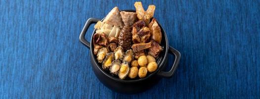 Traditional food of Chinese lunar new year, Buddha jumps over the wall, Chinese Soup Casserole dish, Buddha's Temptation, named Fo Tiao Qiang, close up. photo