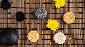 Colorful beautiful moon cake, mung bean cake, Champion Scholar Pastry cake for Mid-Autumn festival traditional gourmet dessert snack, top view, flat lay. photo