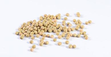 Yellow-green Taiwanese organic non-GMO soybeans, soy beans in a container isolated on white backgorund, close up, clipping path. photo