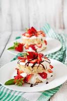 Sponge cake with cream and strawberries photo