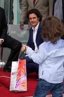 LOS ANGELES, APR 2 - Orlando Bloom, Flynn Bloom at the Orlando Bloom Hollywood Walk of Fame Star Ceremony at TCL Chinese Theater on April 2, 2014 in Los Angeles, CA photo