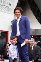 LOS ANGELES, APR 2 - Orlando Bloom, Flynn Bloom at the Orlando Bloom Hollywood Walk of Fame Star Ceremony at TCL Chinese Theater on April 2, 2014 in Los Angeles, CA photo