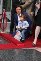 LOS ANGELES, APR 2 - Orlando Bloom, Flynn Bloom at the Orlando Bloom Hollywood Walk of Fame Star Ceremony at TCL Chinese Theater on April 2, 2014 in Los Angeles, CA photo