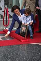 LOS ANGELES, APR 2 - Orlando Bloom, Flynn Bloom at the Orlando Bloom Hollywood Walk of Fame Star Ceremony at TCL Chinese Theater on April 2, 2014 in Los Angeles, CA photo