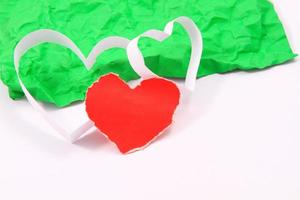 Paper hearts on white background photo