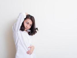 Portrait of young asian woman standing and smiling photo