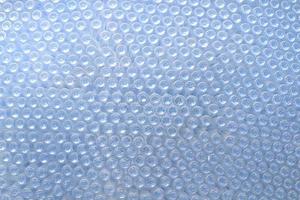 rows of empty plastic bottles at bottling plant photo