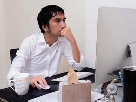 Male architect working with laptop in the office photo