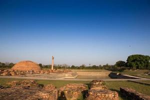 Ananda Stupa and Ashoka pillar photo